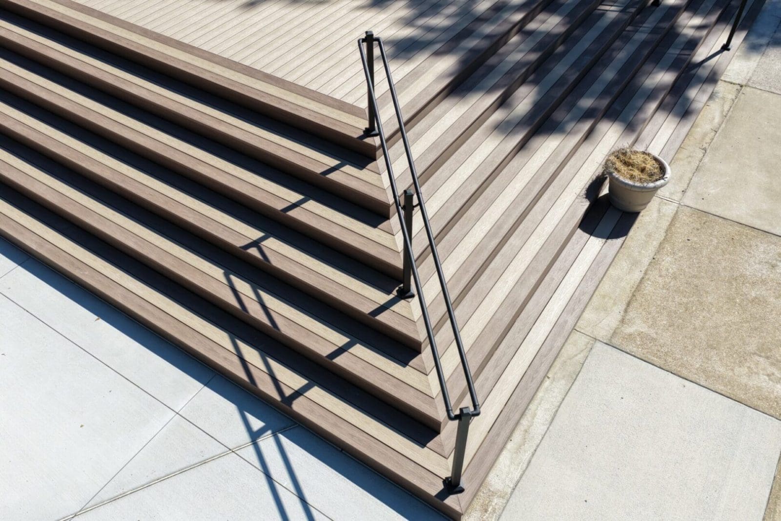 Composite deck stairs with black railing built by B&B Decks in Hampton Roads, VA